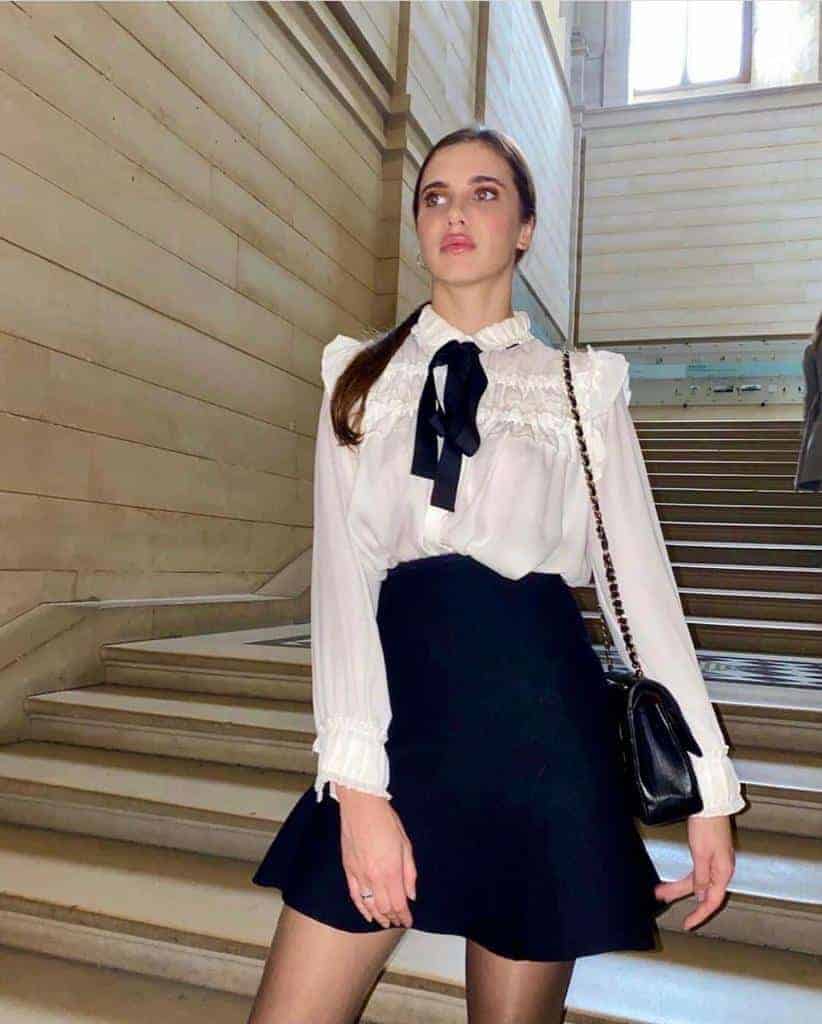 Woman in elegant outfit on staircase