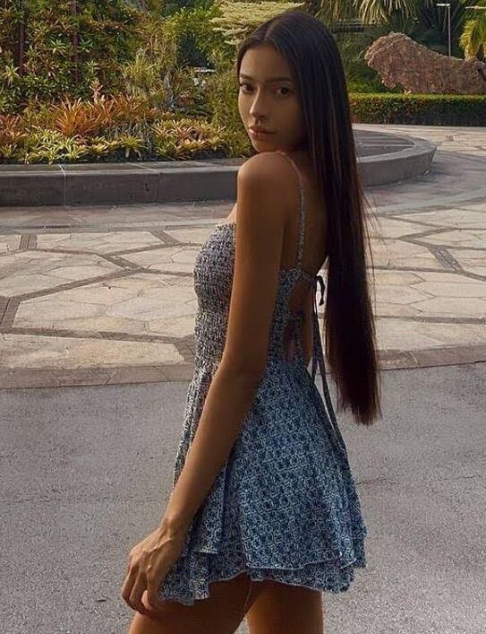 Woman in blue dress at Singapore's Gardens by the Bay.